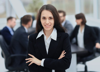 Face of beautiful woman on the background of business people