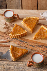 Fototapeta na wymiar Fresh Homemade Pumpkin Pie made for Thanksgiving. Pie on a wooden background. Rustic.