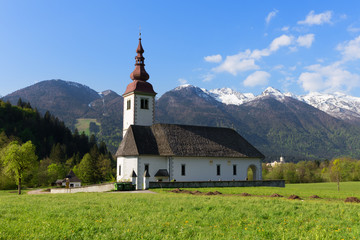 Fototapeta na wymiar Typical slovenian church in the mountains, near Bohinj lake, Triglav National Park, Slovenia