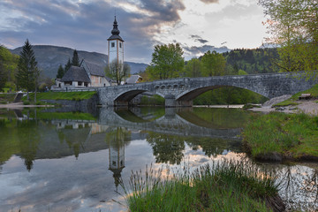 Church of Sv. John the Baptist and a bridge by the Bohinj lake, Triglav National Park, Slovenia