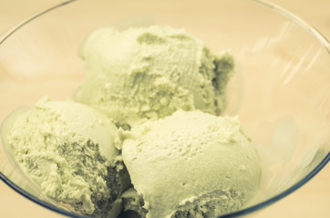 Fototapeta na wymiar beautiful ice cream in a glass/spheres of pistachio ice cream in a glass