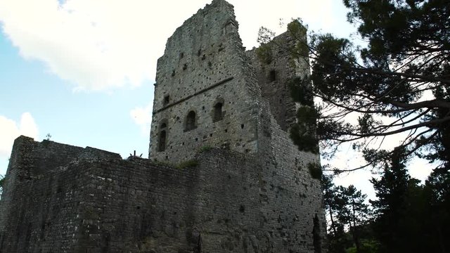 An ancient ruines of a tower in little town near Arezzo in Tuscany, Italy, 4K