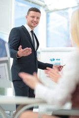 Attractive man making a business presentation to a group