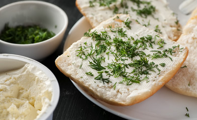 Sandwiches with cream cheese sprinkled with fresh dill, closeup shot