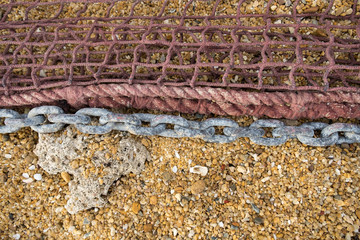 A part of safety net on sand beach. Detail. Copy space.