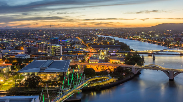 Brisbane City, Australia, Beautiful Panorama Aerial View of Kurilpa Bridge, William Jolly Bridge and Merivale Bridge over Brisbane River with GOMA and Brisbane Cityscape at Sunset Summer, Queensland