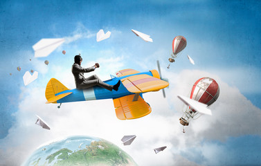 Aviator in retro plane. Mixed media