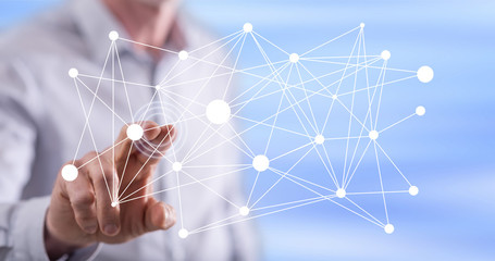 Man touching a virtual network on a touch screen