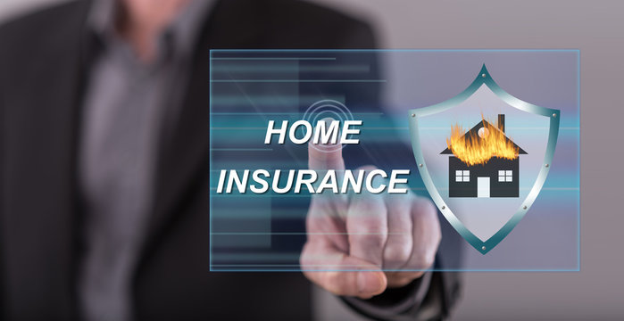 Man touching a home insurance concept on a touch screen