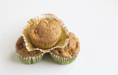 wholegrain muffins with apples on a dark wood background. tinting. selective focus