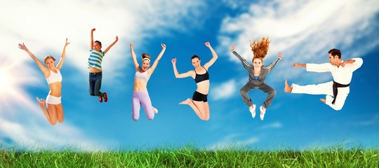 Composite image of man and women jumping over white background