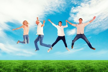 Fototapeta na wymiar Composite image of men and women jumping against white backgroun