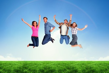 Composite image of full length of friends jumping