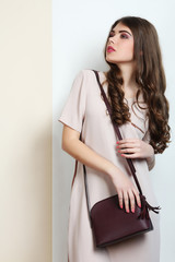 girl in a dress and a bag