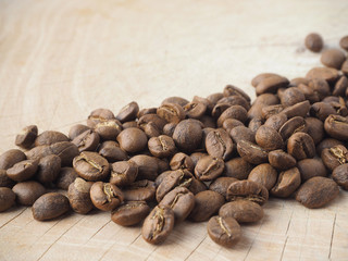 Close-up of coffee beans on wooden table