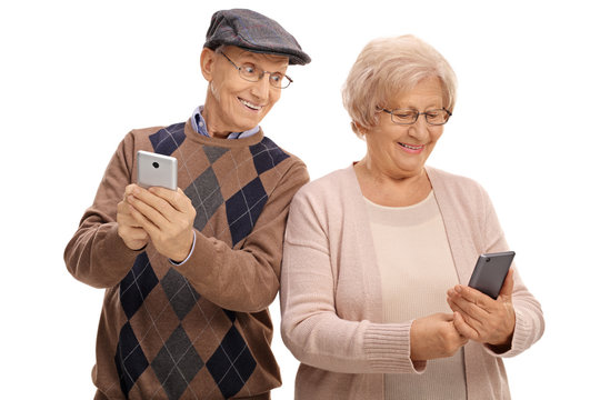 Elderly man looking at the phone of his wife