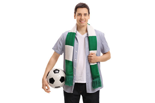 Young soccer fan with a scarf and a football