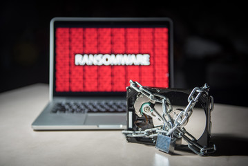 Hard disk file locked with monitor show ransomware cyber attack internet security breaches. Malware lock file concept for security article i.e. WannaCry or WannaCrypt attack all over the world