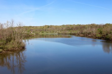 The wide lake and the park landscape.