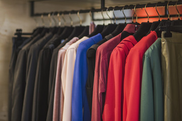 Fototapeta premium Women boutique shop concept - colorful clothing on hangers.