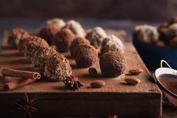 Chocolate candy truffles on a dark background