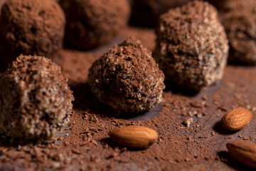 Chocolate candy truffles on a dark background