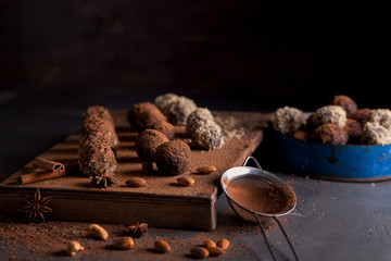 Chocolate candy truffles on a dark background