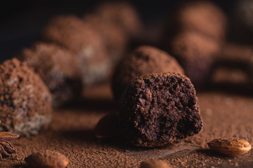 Chocolate candy truffles on a dark background