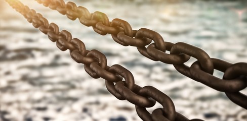 Composite image of 3d rusty metallic chains 