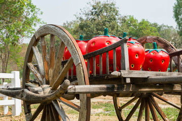 Big strawberry on wooden cart