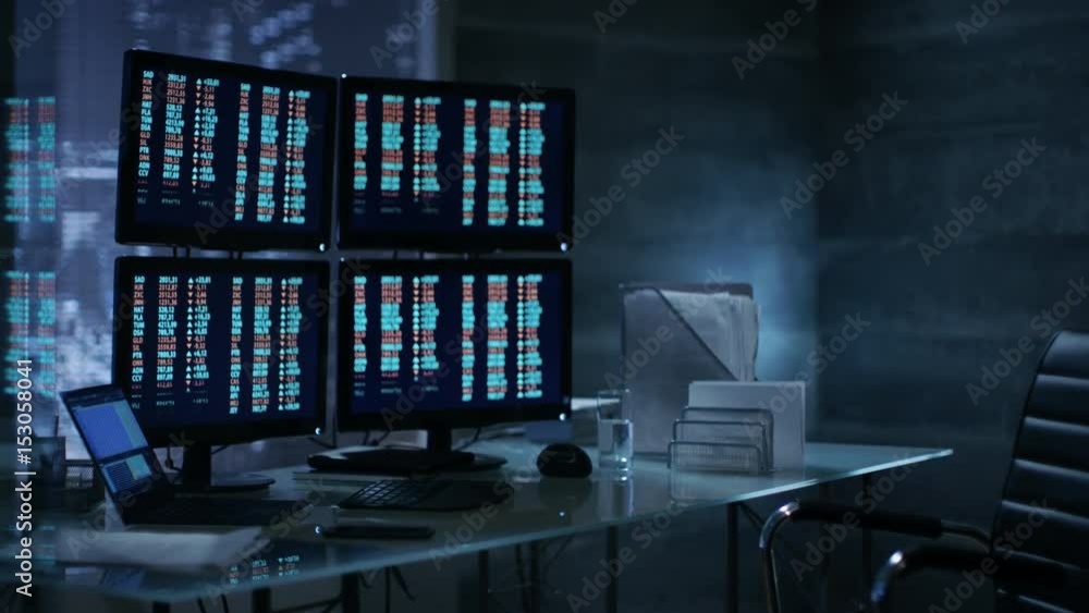 Poster big city stockbroker's office with multiple displays showing data and stock numbers. shot on red epi