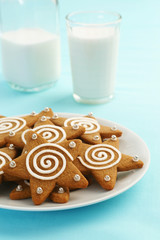 Iced Gingerbread Star Cookies with a Glass of Milk