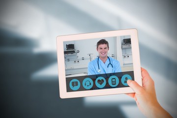 Composite image of masculine hand holding tablet