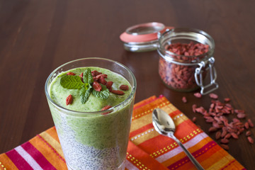 Healthy spinach and apple smoothie with milk and chia