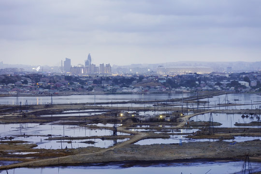Baku, Azerbaijan - 17 July, 2015: Oil pollution flowing from pumps on shore in Bayil
