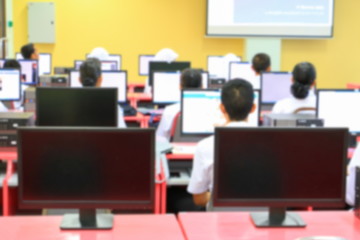 focus blur, the student with teacher learning business technology desktop computer in a classroom