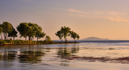 Beautiful serene lake evening light at sunset
