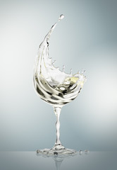 White wine glass on gray background