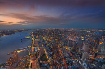 Manhattan midtown skyline panorama at night time, New York, USA