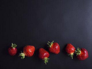 Fresh, red, ripe strawberries isolated on black background