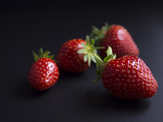 Fresh, red, ripe strawberries isolated on black background