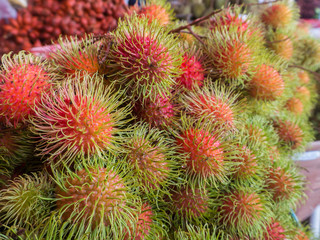  rambutan on shelf at fruit shop. seasonal fruit in Thailand.
