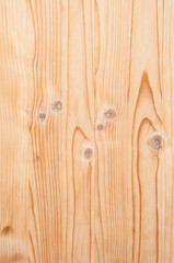 Fototapeta premium Vertical structure of wood with strips and knots close-up