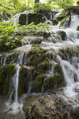 Fototapeta na wymiar waterfall stream through the forest 