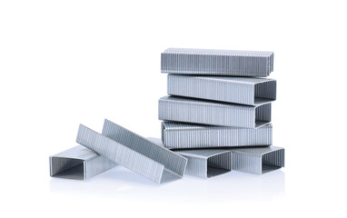 Fototapeta premium Stack of metal staples isolated on white background.