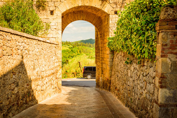View of the medieval castle town of Monteriggioni in the hills of Siena in Tuscany