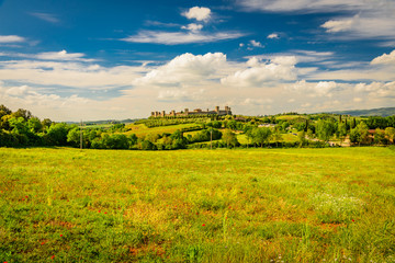 View of the medieval castle town of Monteriggioni in the hills of Siena in Tuscany