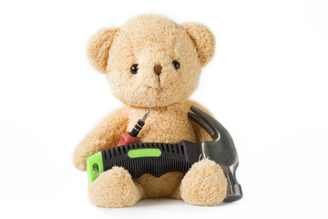 Bear doll sitting with screwdriver and hammer technician on whitebackground isolated.