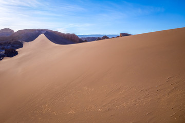 Fototapeta na wymiar Sand dunes in Valle de la Luna, San Pedro de Atacama, Chile