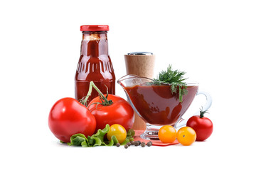 Still life of red and yellow tomatoes, bottle of tomato sauce and dill on a white background. An isolated object.